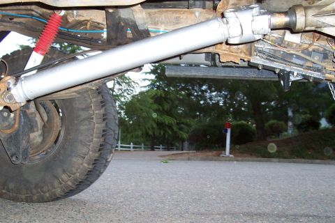 1994 Ford F-150 - Close-up of the driveshaft and rear suspension components of a vehicle.