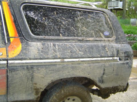 1979 Ford Bronco - This 1979 Ford Bronco is heavily covered in mud after off-road use.