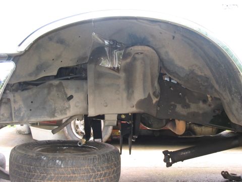 1989 Ford Bronco - This photo shows the undercarriage of a vehicle, focusing on the suspension and wheel area.
