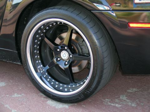 1993 Ford Probe - Custom wheel and tire detail on a black vehicle.
