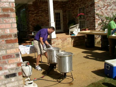 1995 Ford Bronco - An outdoor cooking scene with propane tanks and large pots set up on a patio.