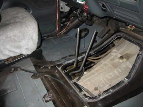 1992 Ford Bronco - Vehicle interior with center console removed, revealing the floor and transmission tunnel area.