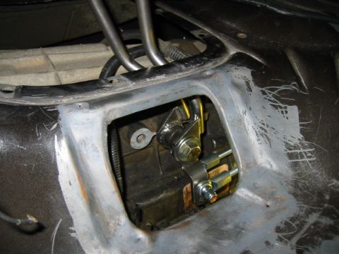 1992 Ford Bronco - Close-up of a vehicle's transfer case linkage, showing mechanical components and wiring.