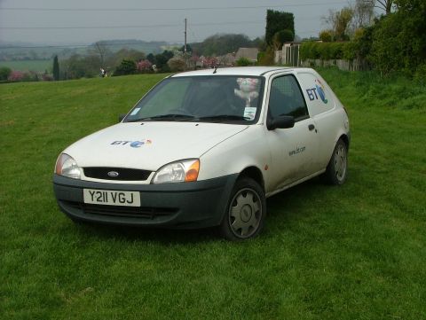 2001 Ford Fiesta - White Ford van with BT logo parked on a grassy hill.