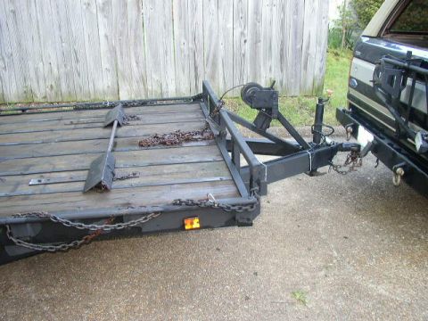 1995 Ford Bronco - Trailer hitch and chains are visible, attached to the rear of a vehicle.