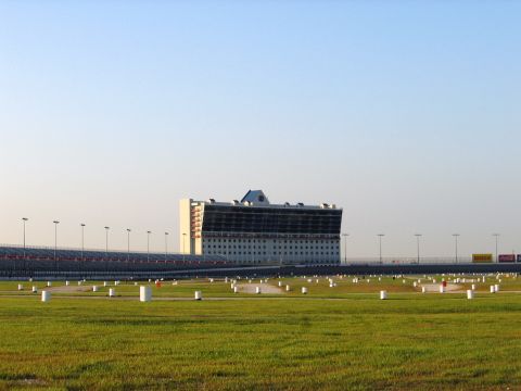 2000 Ford Crown Victoria - The grandstands and field of Texas Motor Speedway are visible under a clear sky.