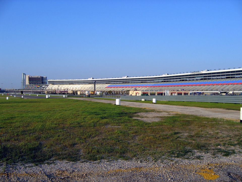Texas Motor Speedway grandstands and track under a clear blue sky