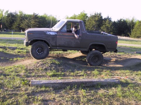 1983 Ford Bronco - This lifted 1983 Ford Bronco navigates an off-road course.