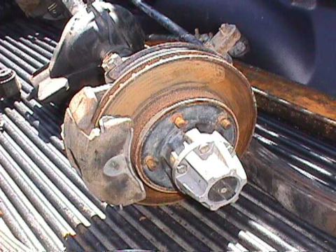 1984 Jeep Wrangler - Close-up of a Jeep brake rotor and caliper, likely a spare part.