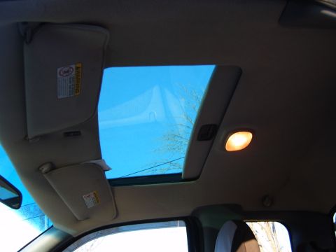 1993 Ford Bronco - Interior view of a vehicle's cabin, focusing on the sunroof and sun visors.