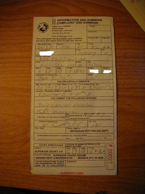 1997 Ford Taurus - A summons copy document with handwritten details about an offense and court appearance.