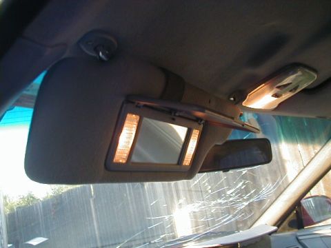 1993 Ford Probe - The illuminated vanity mirror on the sun visor is visible in this interior car shot.