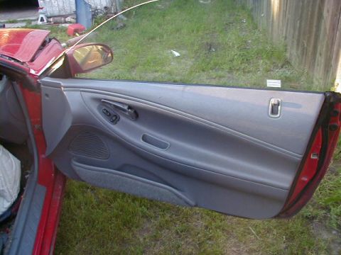 1993 Ford Probe - Interior view of the driver's side door panel on a 1993 Ford Probe.