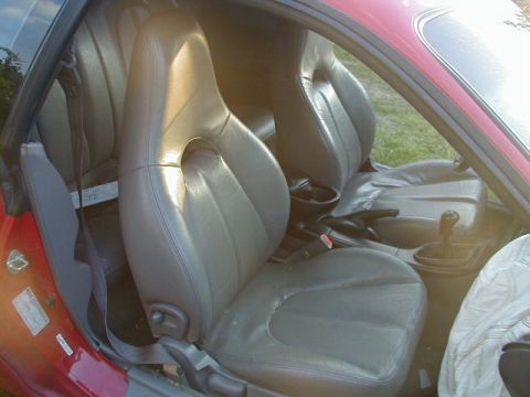 1993 Ford Probe - The interior of a car, focusing on the front seats and the center console area.