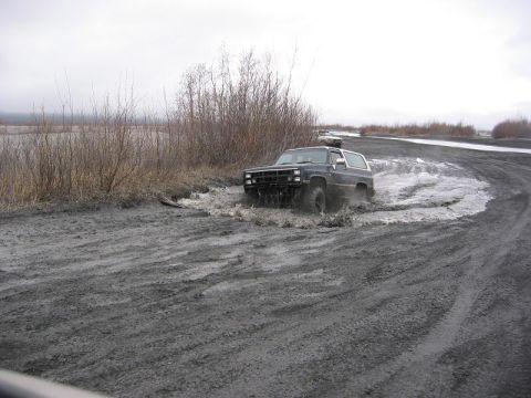 1985 Ford Bronco - Mike Blasting through a small mud hole.