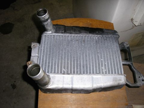 1990 Ford Probe - A car radiator part is shown in this close-up image.