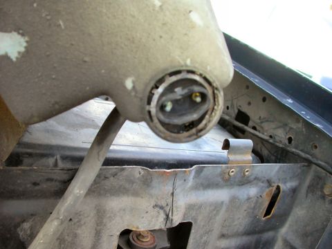 1990 Ford Bronco - Take the Flathead screwdriver and pry out this retainer. Don't worry if you bend/break it, you get a new one with the new pump.