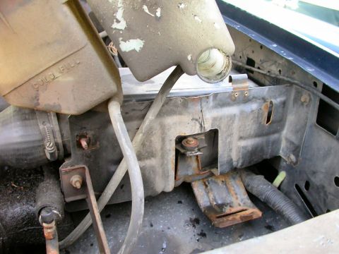 1990 Ford Bronco - You could let the fluid drain out of the hose off to the right. It's sllooowwww.....I say just dump it. Make sure to clean the area around…