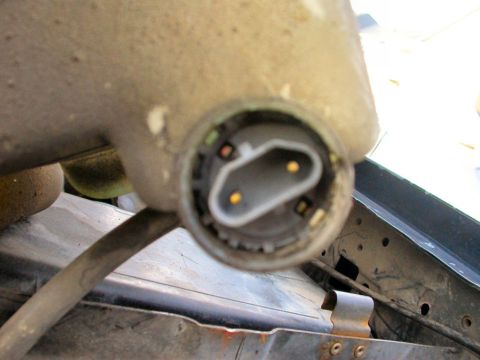 1990 Ford Bronco - Blurry picture of the new pump installed. Now just fill the res. back up with washer fluid and you're done.