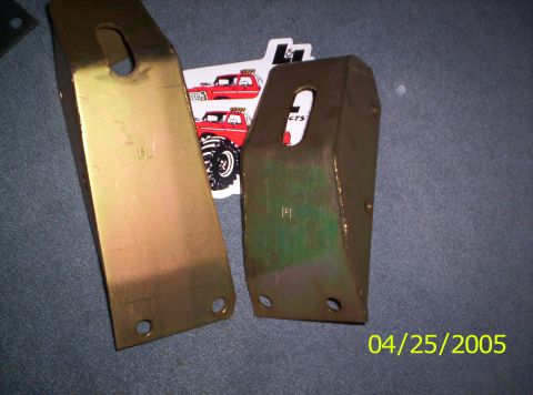 1985 Ford Bronco - Two metal brackets are shown with stickers red Ford Broncos in the background. The date 04/25/2005 is visible.