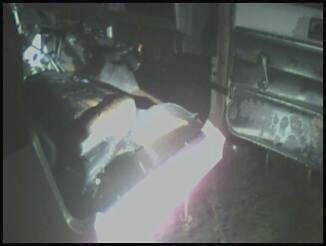 1995 Ford Bronco - The interior of a vehicle is shown, with a bright light illuminating the dashboard area.