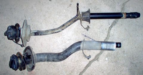 1994 Ford Crown Victoria - TOP - '98 P71 BOTTOM - '94 P73 The new filler neck has a 1/4-turn cap, an external vent line, a check valve at the bottom, and is bent VERY…