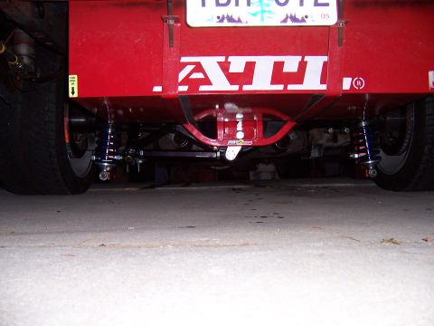 1971 Ford Mustang - Close-up view of a vehicle's modified rear suspension and chassis components.