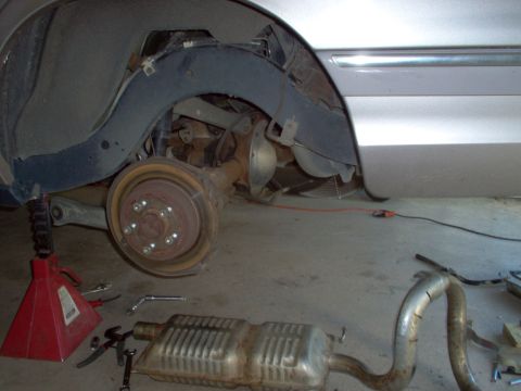 1994 Ford Crown Victoria - I dropped the lower control arm front bolt & e-brake cables, tied the shock up, laid the caliper beside the gas tank, pulled the sway bar e…