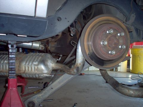 1994 Ford Crown Victoria - Slide it inboard past the shock, & lift it into place.