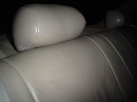 1993 Ford Taurus - Close-up view of the rear seat headrests and upholstery in a vehicle.