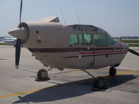 1989 Ford Bronco - Airplane on tarmac with another aircraft visible in the distance.