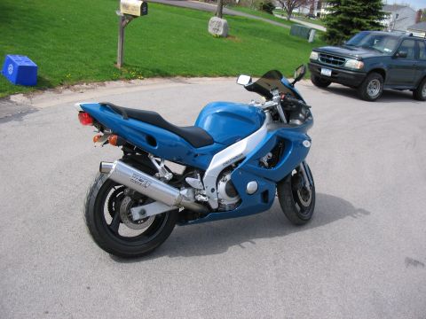 1997 Yamaha YT60 Tri-Moto - A blue sport motorcycle is parked on a street, with a dark SUV visible behind it.
