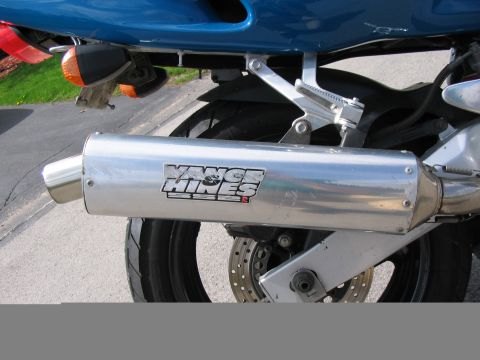 1997 Yamaha YT60 Tri-Moto - Vance & Hines exhaust pipe on a motorcycle rear section.