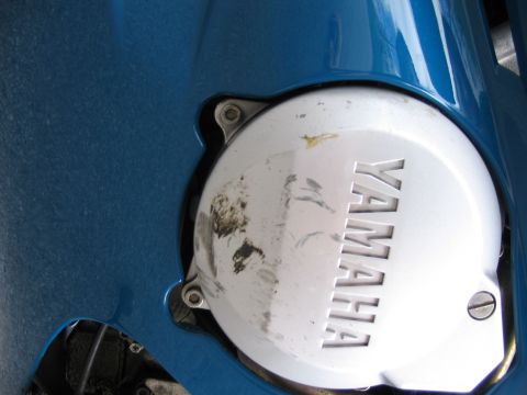 1997 Yamaha YT60 Tri-Moto - Yamaha engine cover detail, showing wear and tear.