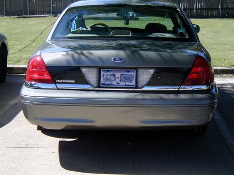 2000 Ford Crown Victoria - Rear view of a 2000 Ford Crown Victoria Police Interceptor, showing its taillights and license plate.