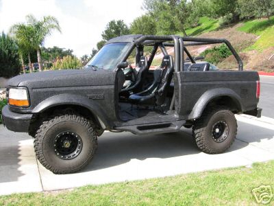 1978 Ford Bronco - This modified Ford Bronco features a roll cage, racing seats, and off-road tires.