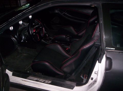 1993 Ford Probe - A shot of the dash area, you can see all the red stitch on everything to complement the seats