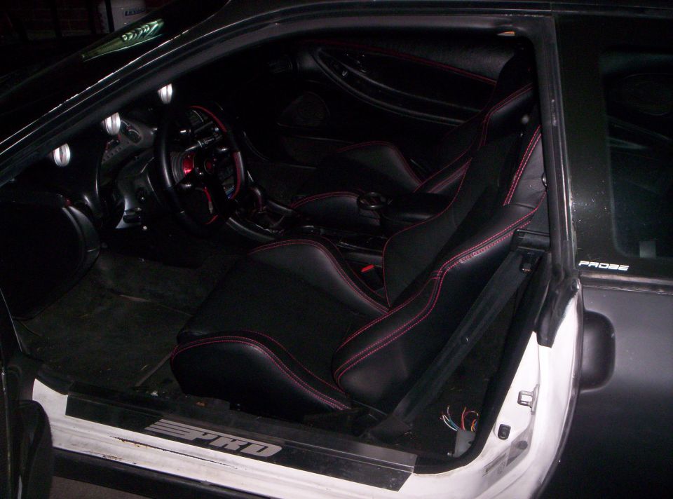 A shot of the dash area, you can see all the red stitch on everything to complement the seats