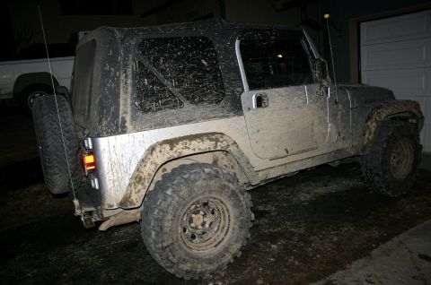 2003 Jeep TJ - This Jeep Wrangler appears to have recently been off-roading, as it is covered in mud.