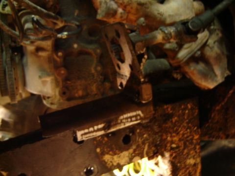 1989 Ford Bronco - Close-up of rusty engine components and frame, with "SUPERMOTORS.NET" visible at the bottom right.