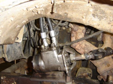 1989 Ford Bronco - Close-up view of the power steering gearbox and associated linkage, likely from a truck or SUV.