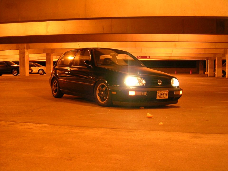 1996 Volkswagen GTI parked in a dimly lit garage, front view