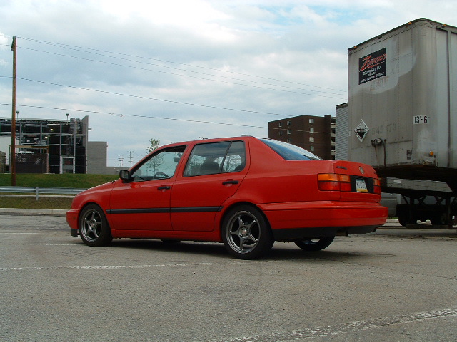 Red 1994 Volkswagen Jetta sedan, rear 3/4 view