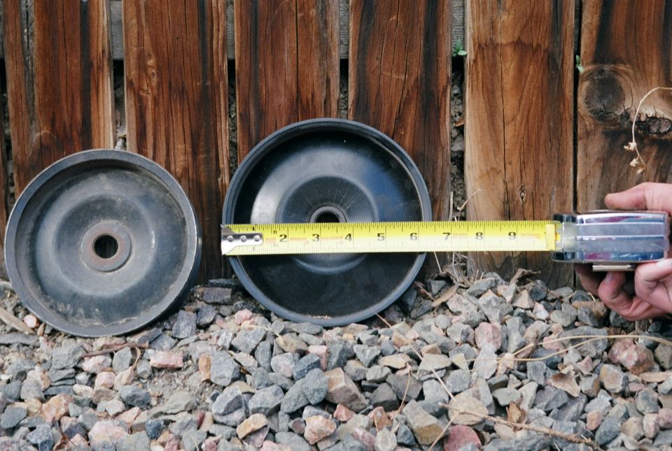 The two pulleys again.  The GM pulley measures 6.5" diameter.  The center hole is .755".