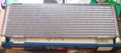 1988 Ford Bronco - Close-up of an automotive radiator or condenser part, likely for sale on Supermotors.net.