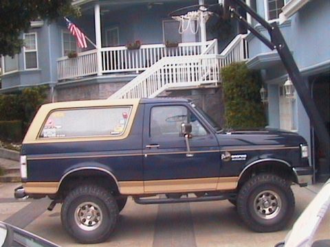 1991 Ford Bronco - This 1991 Ford Bronco is parked in front of a house with a basketball hoop overhead.