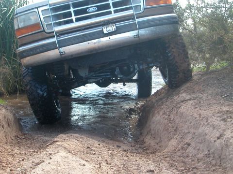 1992 Ford F-150 - This 1992 Ford F-150 is navigating a muddy water obstacle.