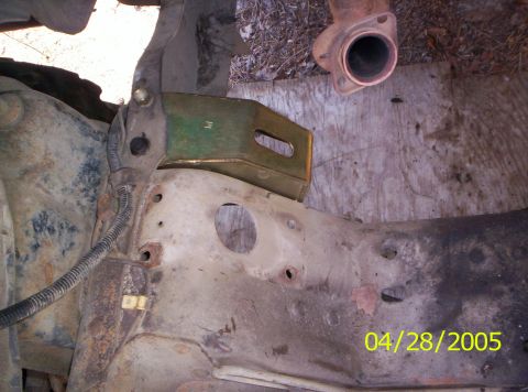 1985 Ford Bronco - Close-up view of vehicle frame and exhaust pipe, dated 04/28/2005.