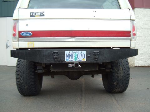 1989 Ford Bronco - Rear view of a 1989 Ford Bronco, showing its custom bumper and tires.