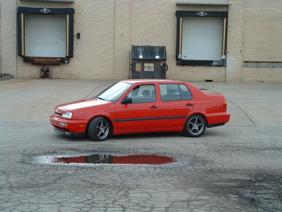 Red 1994 Volkswagen Jetta sedan, side view